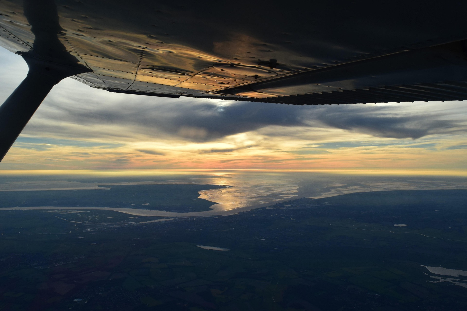 Cessna wing view at sunset